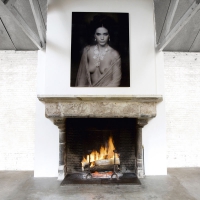 Eclectic mix between a vintage French fireplace from the 15th Century and contemporary art work of Marc Lagrange.