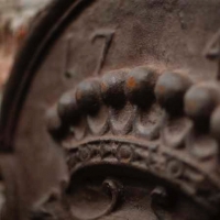 Detail of a original Fireback in Cast iron from the 18th Century.