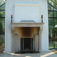 Fine French Country Vintage Antique Fireplace Surround in Limestone used as an open fireplace.