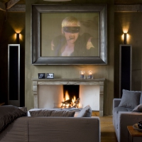 Antique French Stone Fireplace Surround In Home-Theater
