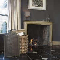 19th century French Limestone Antique Fireplace Surround in a corner of the room.