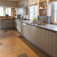 ancient surface tiles in natural stone in a timeless kitchen interior design.