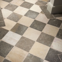Antique Checkboard Style Recut Flooring With Border In French Limestone.