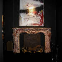 Monumental and Grand original vintage marble fireplace surround in combination with modern artwork   